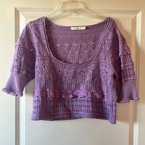 Size small cropped purple crocheted sweater.